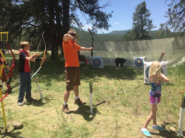 A family practicing archery at Staunton State Park
