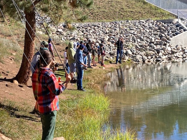 People fly fishing at Davis Ponds in Staunton State Park, Pine, Colorado